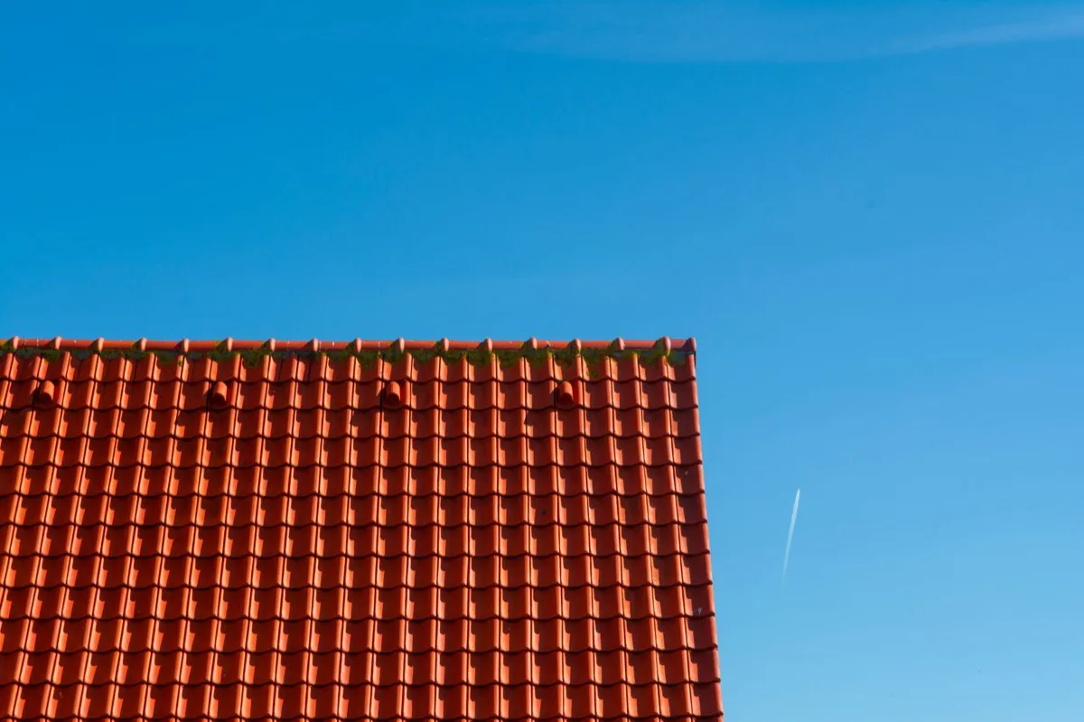 Tile roof gable in full sun, the kind of exposure that sets roof life in South Bend, IN